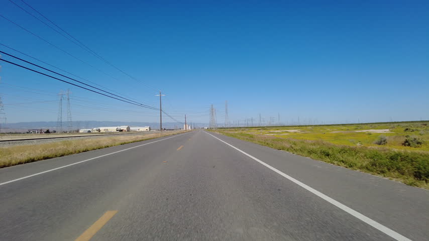 San Joaquin Valley Farmland Buttonwillow 04 Front View Driving Plates of Highway 58 West California USA
