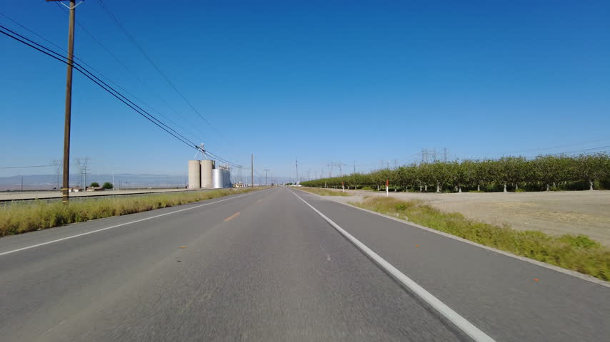 San Joaquin Valley Farmland Buttonwillow 05 Front View Driving Plates of Highway 58 West California USA