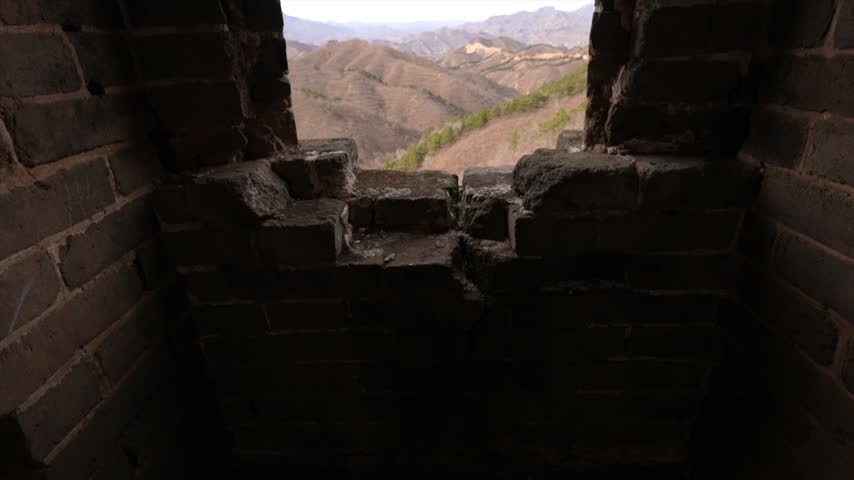 Broken stone window of a watch tower on the UNESCO Great Wall of China.