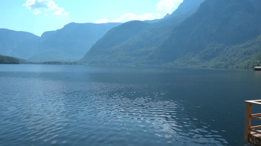 Hallstatt Lake with Alpine Mountains and blue water in Austria Nature landscape.