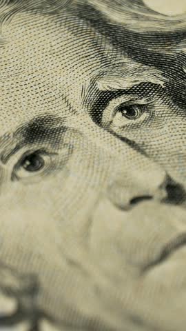 Stacked 20 dollar bills with portrait of Andrew Jackson prominently visible. Medium of exchange facilitating purchases, commercial dealings, and monetary transactions