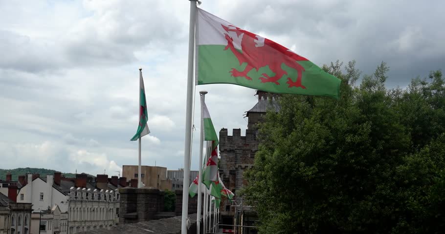 Welsh flags waving on Cardiff Castle walls
