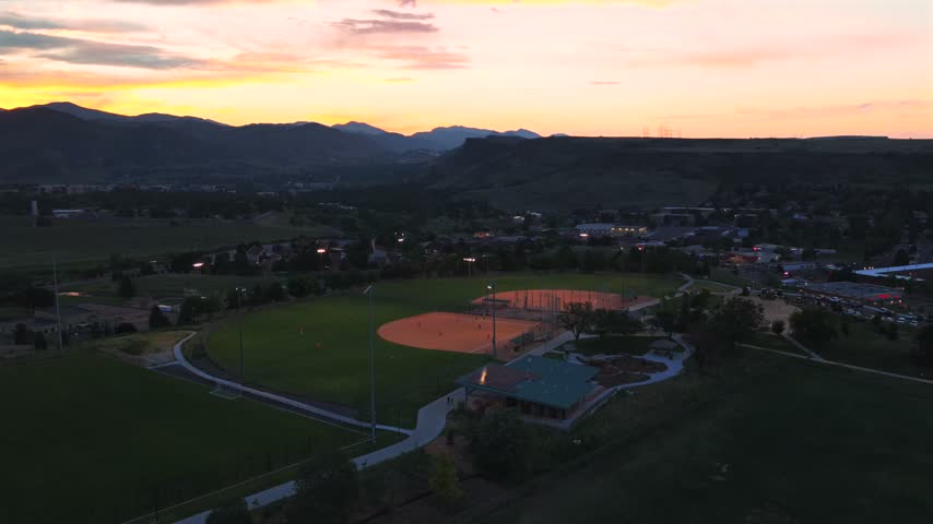 Ulysses Sports Complex Field Skatepark under lights summer sunset City of Golden aerial drone Colorado Rocky Mountains Front Range foothills Clear Creek Canyon South Table Mountain parking lot upwards