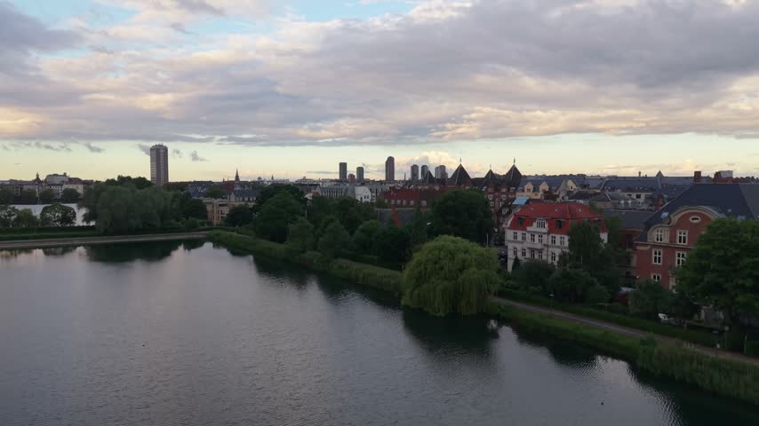 Drone elevation from a lakeside building unveils Copenhagen