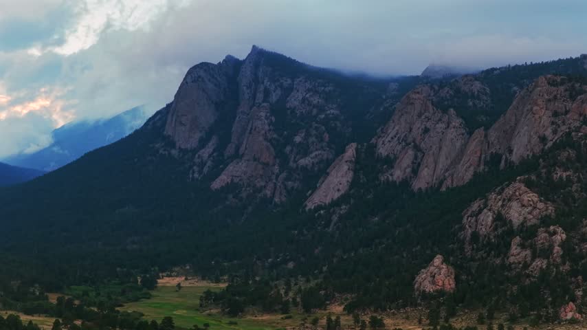 Estes Park McGregor Mountain The Needles summer low rain clouds sunset blue hour Black Canyon Creek Balanced Rock landscape aerial drone Colorado Front Range Rocky Mountains National Park circle up
