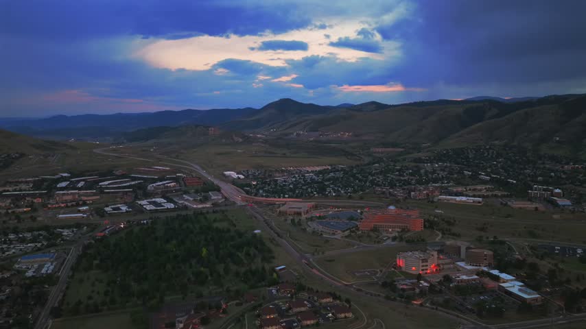 Summertime Front Range Colorado aerial drone sunset golden blue hour cloudy skies Golden Jefferson County Courthouse i70 highway Lookout Mountain Genesse Red Rocks Amphitheater and Park forward circle