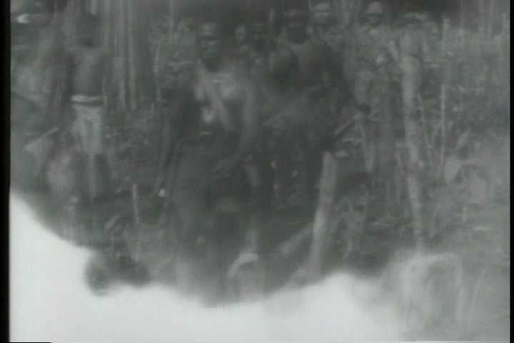 1940s - Native New Guineans teach American troops how to fight in World War Two.