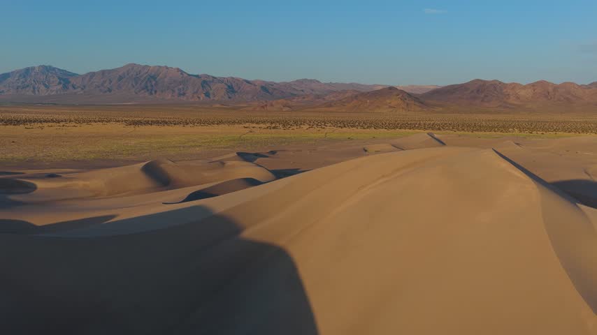 Aerial Big Dune Nevada Desert Landscape and Mountain Range Flyover
