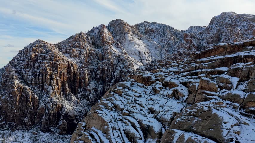 Aerial Red Rock Canyon Snowy Mountains Las Vegas Nevada Flyover