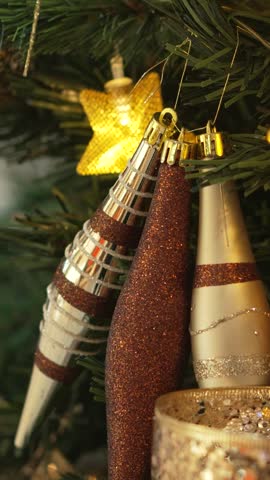 Close-up of Christmas tree with many golden ornaments. Luxury decoration. 4k.