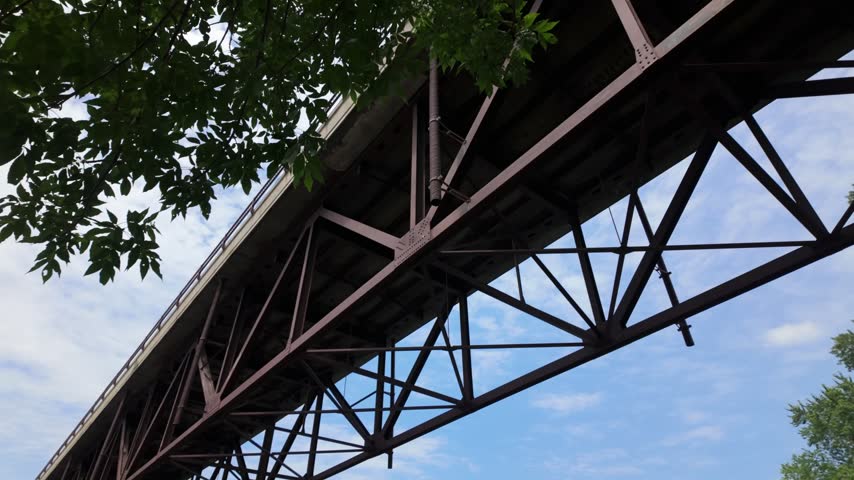 Gimbal close-up panning shot of a bridge over the St. Croix River in Osceola, Wisconsin. 4K