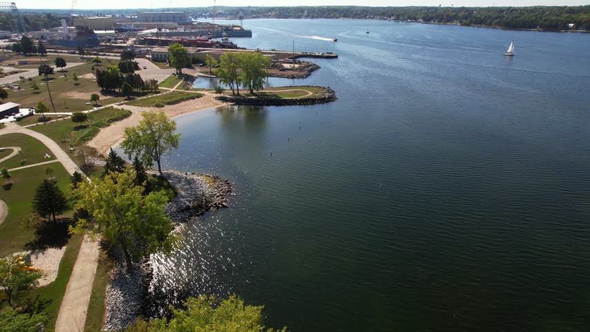 Approaching shipyard and incoming boat Aerial of Sturgeon Bay Wisconsin in Door County during the fall.  