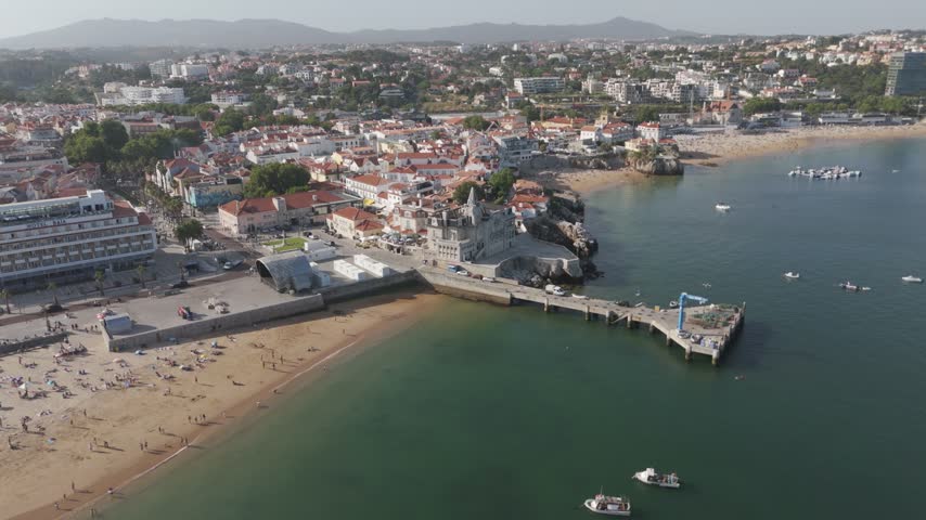 Aerial - Cascais Bay with its beach pier boats and town on the Lisbon coast