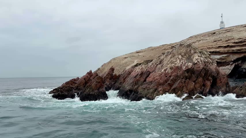 Powerful Pacific Ocean Waves Crashing Against Rocky Ballestas Islands in Peru