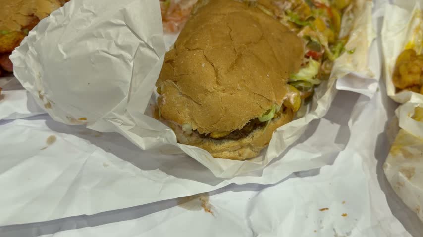 A burger patty Gatsby on a counter top at a Cape Town, takeaways.