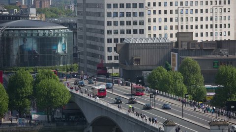 buses and vehicles on waterloo bridge in london
