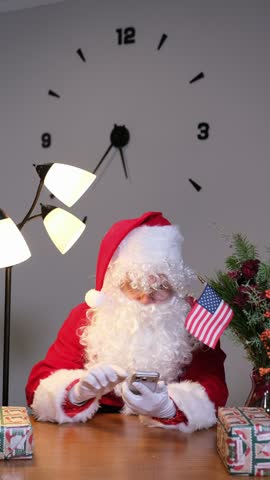 Modern american santa claus answering a phone call
