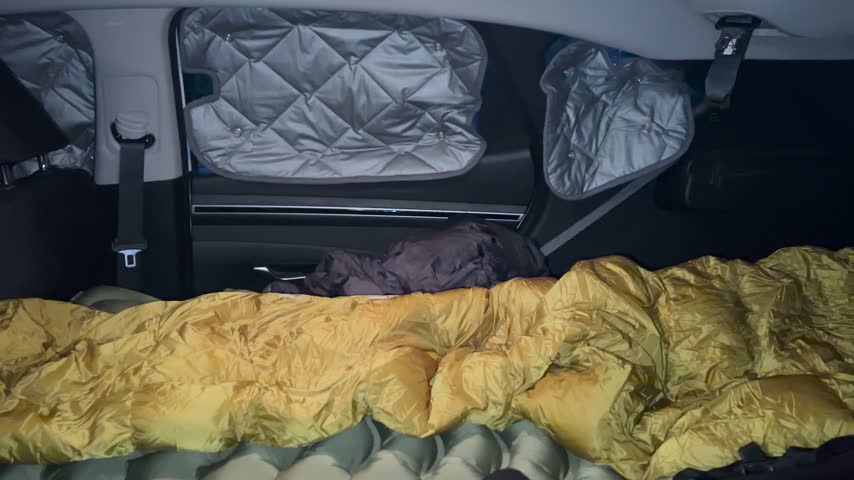 Waking up in a car camper to see the moon and Venus over the Pyrenees mountains before sunrise