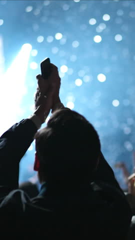 Cheering fan hang out music concert. Fun person enjoy epic neon light party. Cool live show. A lot of happy people clap night club fest. K pop rave event. Joy teen raise hands up applaud. Disco glow.