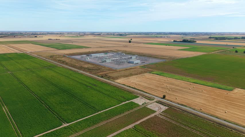 Aerial view of the Triton Knoll offshore windfarm substation surrounded by agricultural fields in Boston, England, United Kingdom.
