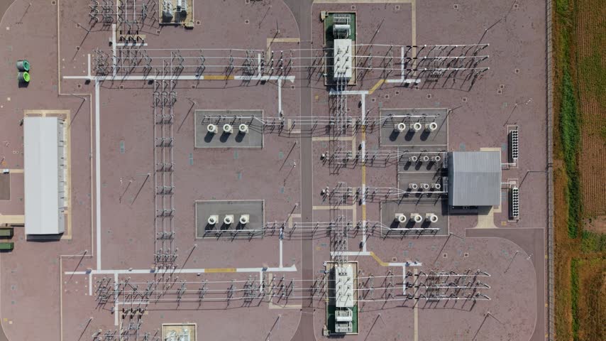 Aerial view of the Triton Knoll offshore windfarm 400220kV substation featuring electrical transformers, switchgear, and power lines in Boston, England, United Kingdom.