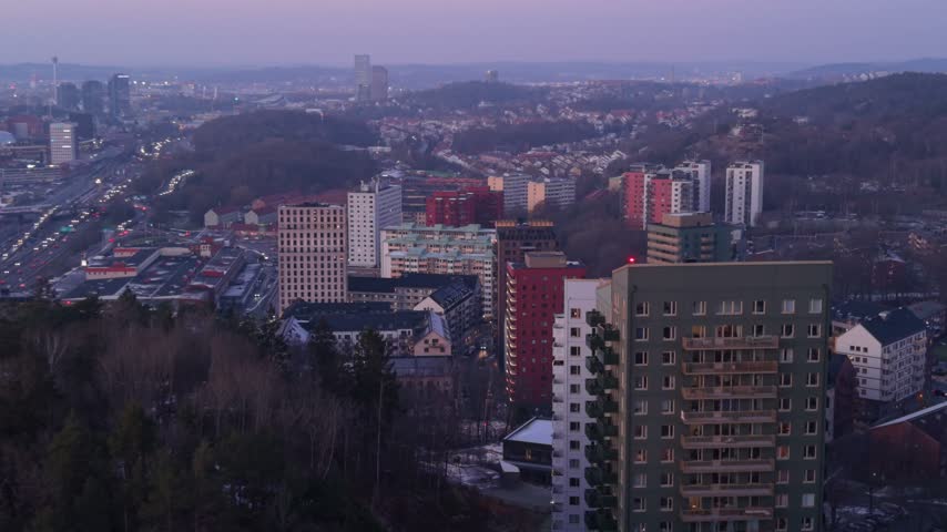 Aerial view of Kalleback residential area with apartment buildings and highway at sunset in Gothenburg, Vastra Gotaland Count, Sweden.
