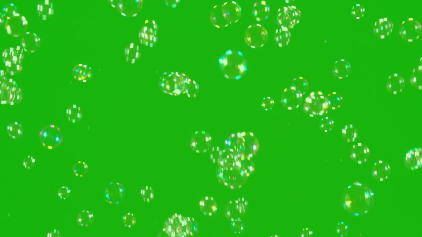Soap Bubbles Green Screen. A large number of soap bubbles moving in one direction against a green background. Great for use in blending