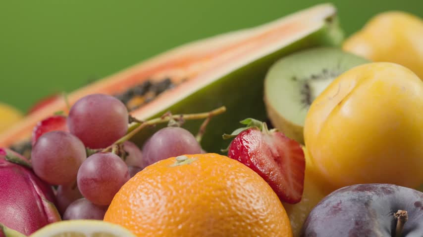 assorted fresh colorful fruits and berries rotating in a vibrant composition. Juicy peach, orange, strawberries, blueberries, kiwi, and grapes showcase natural freshness, rich textures, and vivid colors. Premium food video ideal for healthy eating, vitamins, summer, nutrition, organic produce, smoothies, desserts, grocery, and food advertising concepts.
