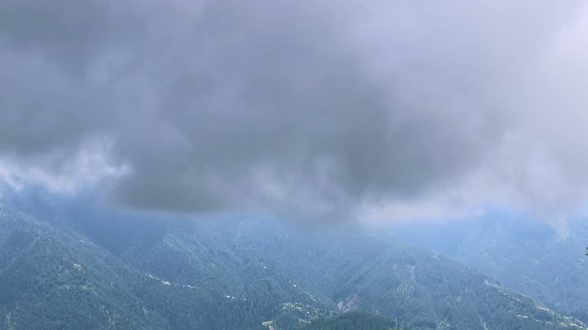 Dark storm clouds gathering over snow capped mountain peaks landscape 180fps Captured in Cinematic High Detail Footage