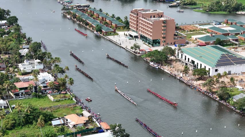 Experience the excitement of the Nehru Trophy Boat Race in Alappuzha, Kerala. Traditional Chundan Vallams, also known as snake boats, race through the beautiful Kerala backwaters as hundreds of rowers