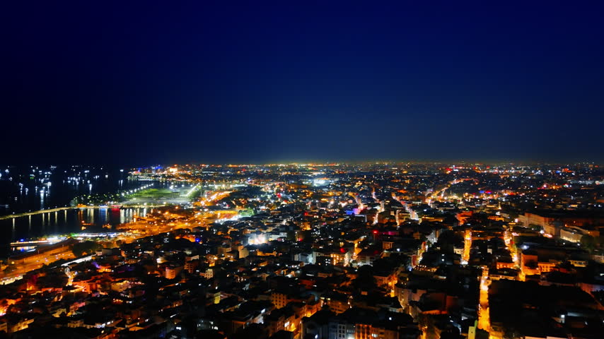 Footage over the urban area of Istanbul lit with street lights. View on Turkey capital at night.