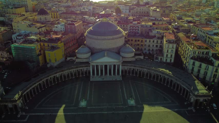 Majestic aerial view of the iconic piazza del plebiscito in naples, italy, showing the grand colonnade and the dome of the church