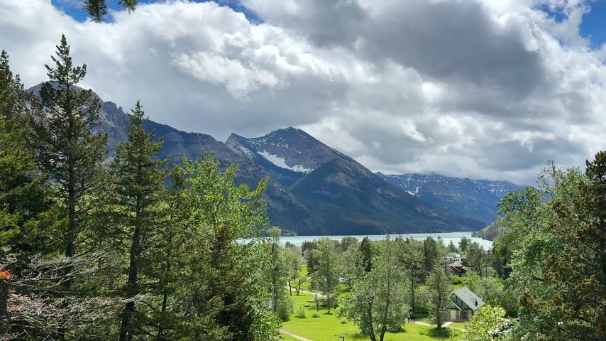Waterton Lakes National Park. The mountains rise in the background under a cloudy sky.