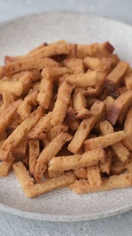 Croutons or crackers made from rye bread with garlic, salt, and spices. Croutons with salt