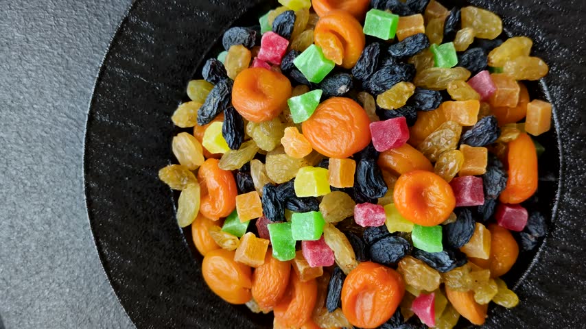 Dried apricots, raisins, and candied fruits as ingredients for baked goods and sweets. Dried fruits