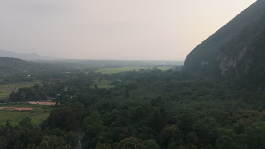 Aerial Drone View Looking Across Hazy Valley and Mountain Slopes in Baling Kedah Video