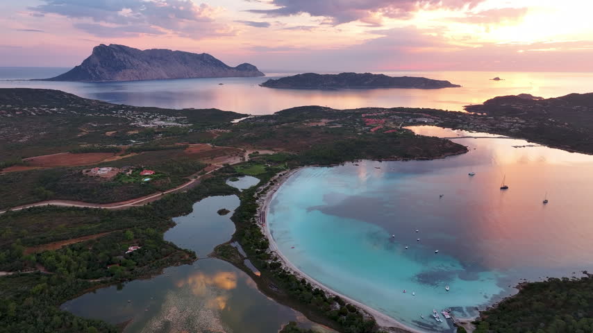 Aerial panoramic view of Cala Brandinchi beach and sunrise. Sardinia, Italy