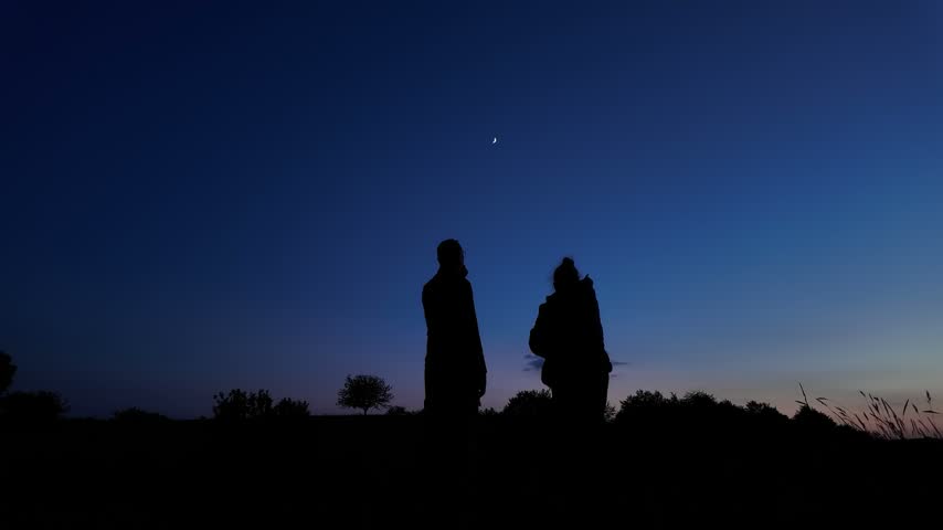 Amateur astronomers enjoying night sky with stars, planets, Moon eclipse and other celestial objects.
