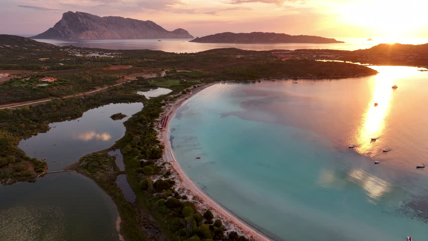 Aerial panoramic view of Cala Brandinchi beach and sunrise. Sardinia, Italy