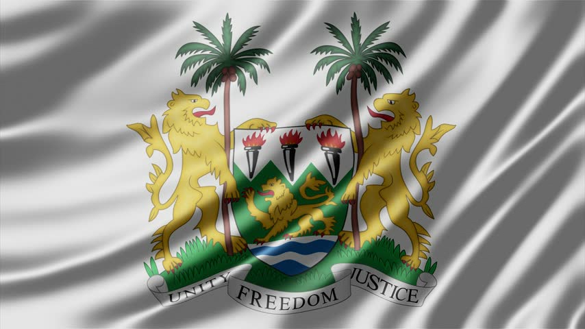 Sierra Leone national flag featuring the official coat of arms ripples gently in the air as smooth silk fabric creates elegant movement in this high resolution digital animation that displays the vibrant colors and proud heraldry of the nation in motion.