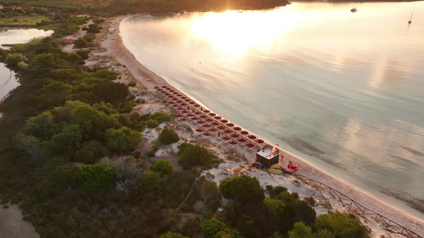 Aerial panoramic view of Cala Brandinchi beach and sunrise. Sardinia, Italy
