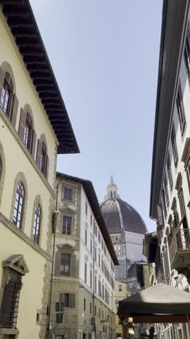 Narrow Historic Street Between Traditional Buildings in Florence Italy
