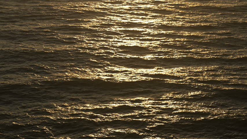 Sunset Reflects In Wavy Pacific Ocean Just off the Oregon Coast