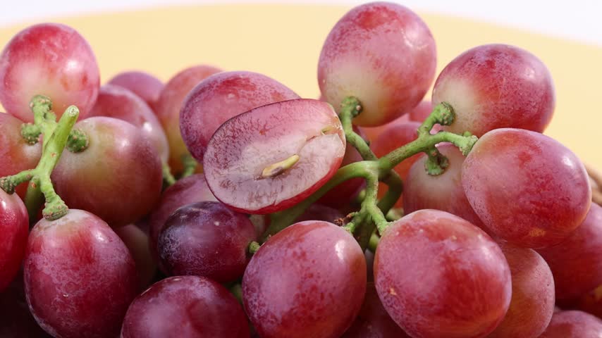 Red Grapes Rotating on a Plate	