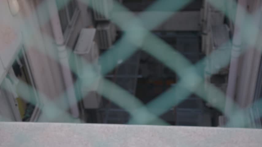 Decaying Urban Building Background Shot, Looking Through Chain Link Fence