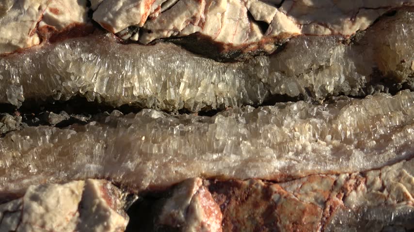 Kas, Turkey - 11 of March 2026: Close up viewing raw calcite crystal formation inside rock fissure
