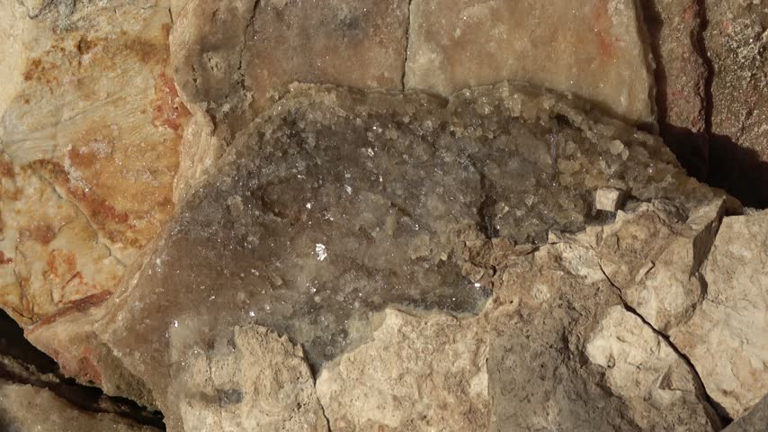 Kas, Turkey - 11 of March 2026: Zoom in Macro shot of grey calcite crystals embedded in limestone rock fissure
