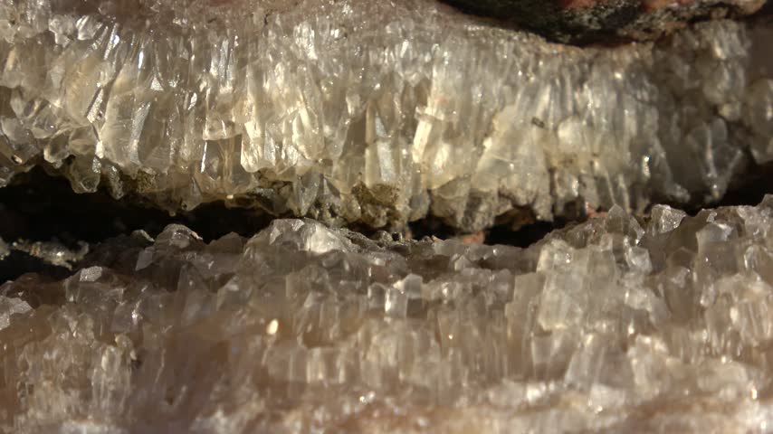 Kas, Turkey - 11 of March 2026: Zoom out Close up raw calcite crystal formation inside rock fissure
