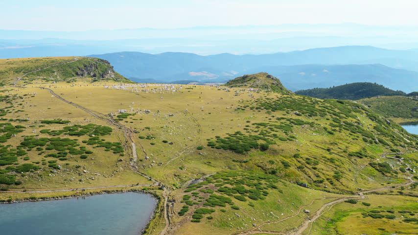 Paneurhythmy participants assemble in concentric rings beside Bubreka Lake, one of the Seven Rila Lakes in Bulgaria