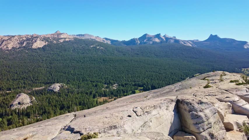 Panoramic view captures Yosemite Valley from the top of Lembert Dome in Yosemite National Park